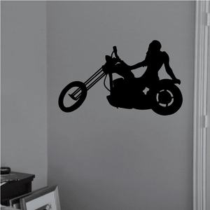 Motorcycle wall decal: black vinyl silhouette of rider on motorcycle.
