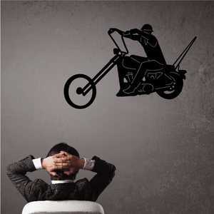 Motorcycle wall decal with black rider on sport bike and front wheel circle