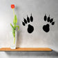 Mountain lion paw track decals, three black paw print silhouettes