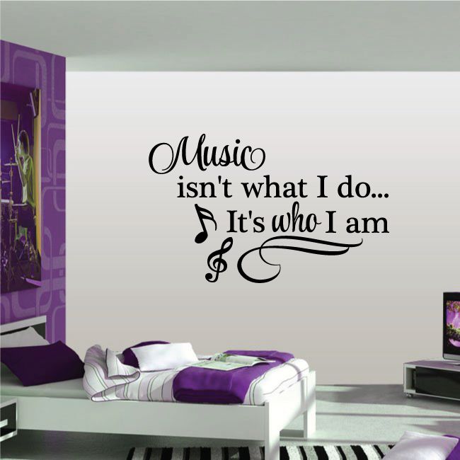 Cursive wall decal quote 'Music isn't what I do... It's who I am' with music notes