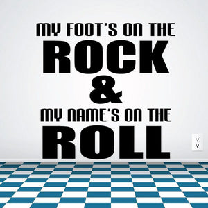 Wall decal with large black lettering: 'Foot's on the rock & name's on the roll'