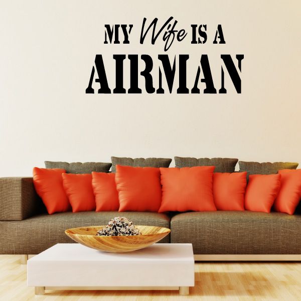 Black wall decal text: “My Wife is a Airman” in bold uppercase letters
