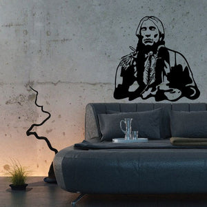 Native American wall decal: kneeling figure in a coat, hands folded.