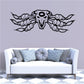 Wall decal featuring black skull with wings and bead-like details