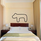 Black outline bear decal on light wall