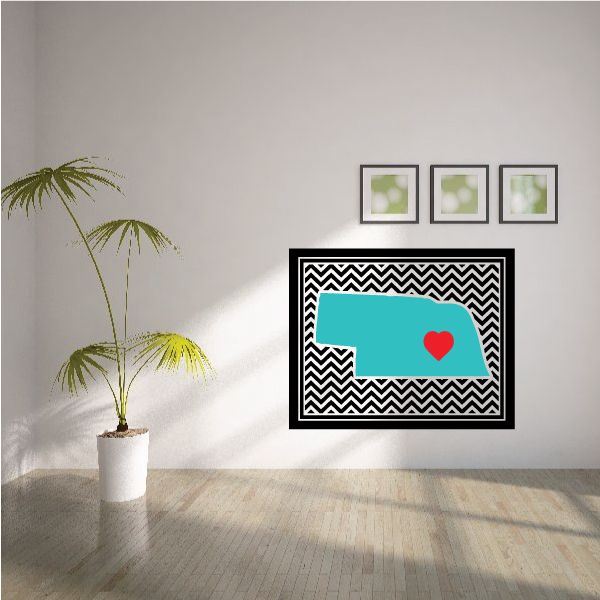 Chevron sticker with black-and-white zigzag border, teal state outline, red heart