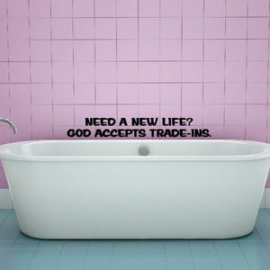 Black wall decal text: “Need a new life? God accepts trade-ins.”