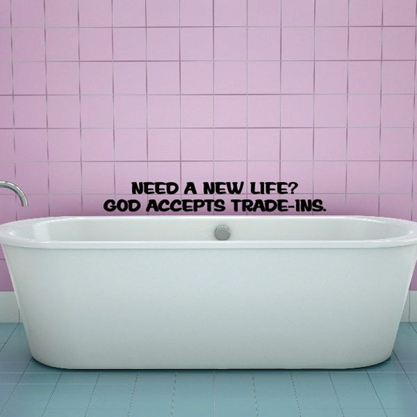 Black wall decal text: “Need a new life? God accepts trade-ins.”