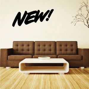 Vinyl wall decal reading “NEW!” in bold black lettering