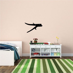 Black airplane wall decal with angled wings and small tail