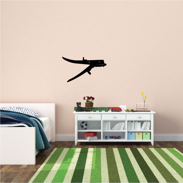 Black airplane wall decal with angled wings and small tail