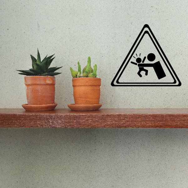 Vinyl decal featuring a black warning triangle with baby-safety icon
