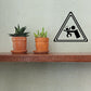 Vinyl decal featuring a black warning triangle with baby-safety icon
