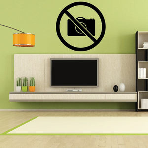Vinyl wall decal featuring a black camera with a diagonal slash inside a circle