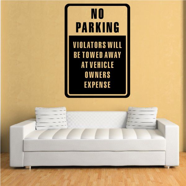 Wall decal sign reading “NO PARKING” and “VIOLATORS WILL BE TOWED AWAY”