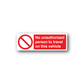 Warning sticker with red no-entry symbol and 'No unauthorized person to travel on this vehicle'