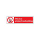 No smoking sign wall decal with crossed cigarette icon and red message: This is a smoke-free building