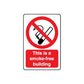 No smoking wall decal: red slash cigarette icon and text 'This is a smoke-free building'