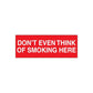 No smoking sign wall decal: red with 'DON’T EVEN THINK OF SMOKING HERE'.