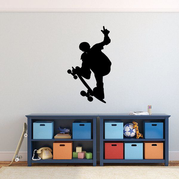 Black skateboarder silhouette wall decal, skater standing on board with arms raised