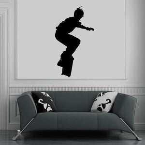 Skateboarding decal with a black skateboarder silhouette