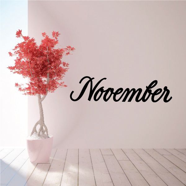 November wall decal with black script text and red autumn tree in pot