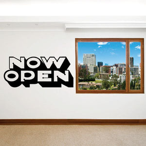 Black and white 'Now Open' wall decal with bold stylized lettering