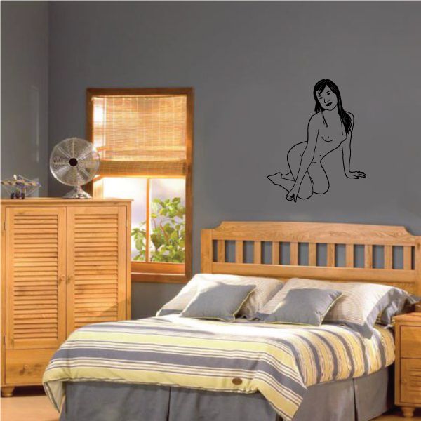 Wall decal of a nude woman kneeling with bent knee, minimalist line drawing