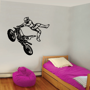 Dirt bike decal with rider kicking side view, black graphic