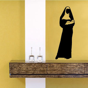 Nun reading Bible decal, black silhouette of a nun with book