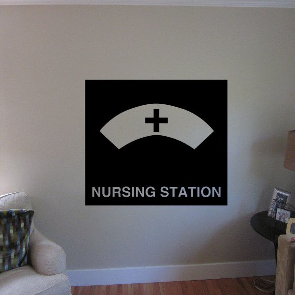Nursing station wall decal: black square with white panel, plus cross, and text
