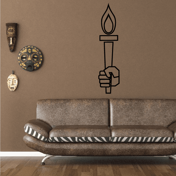 Hand holding torch wall decal with black flame and torch outline