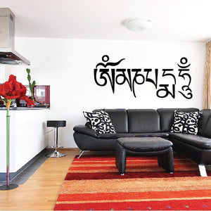 Wall decal with bold black Tibetan script lettering on a light wall