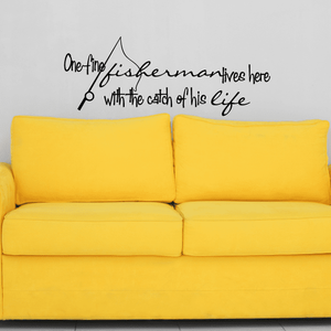 Wall decal with cursive fisherman quote and fishing rod graphic.
