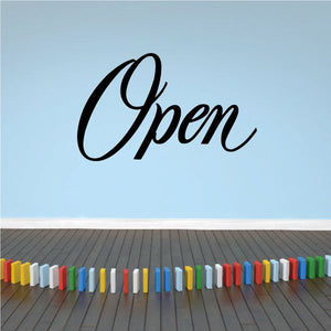 Wall decal with large black cursive word “Open”