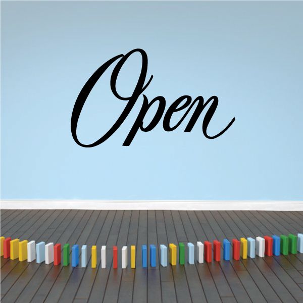Wall decal with large black cursive word “Open”