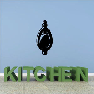 Vinyl wall decal with black orb and green 'KITCHEN' lettering