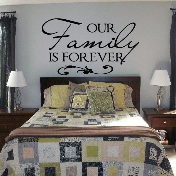 Wall decal text: “OUR Family IS FOREVER” in black cursive lettering with accents