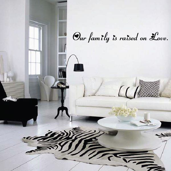 Wall decal: Our family is raised on Love. cursive text with heart
