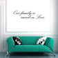 Family wall decal: 'Our family is raised on Love' in script.