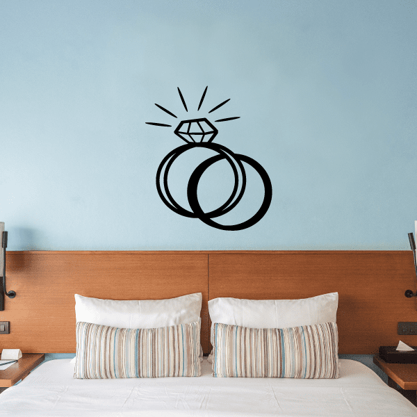 Overlapping diamond ring decal with two stacked rings and a crown-style sparkle on top