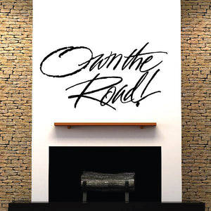 Vinyl wall decal with cursive text 'Own the Road'.