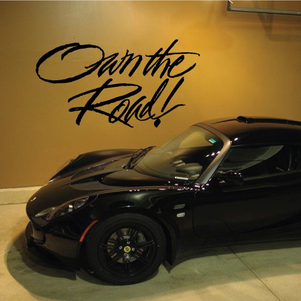 Vinyl wall decal: 'Own the Road!' black script lettering