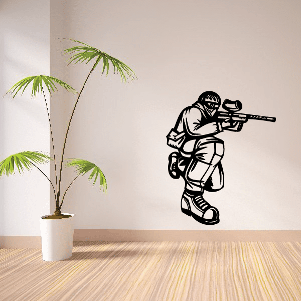 Vinyl paintball wall decal of black paintball player with marker
