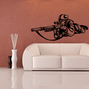 Vinyl paintball wall decal featuring black player silhouette with paintball marker