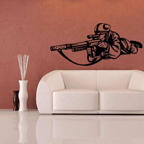 Vinyl paintball wall decal featuring black player silhouette with paintball marker