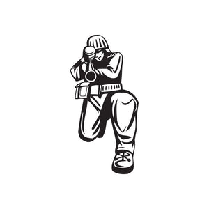 Vinyl paintball wall decal of a black-outlined player holding a paintball marker