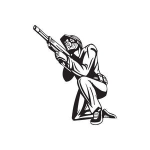 Black paintball player vinyl wall decal with paintball gun silhouette