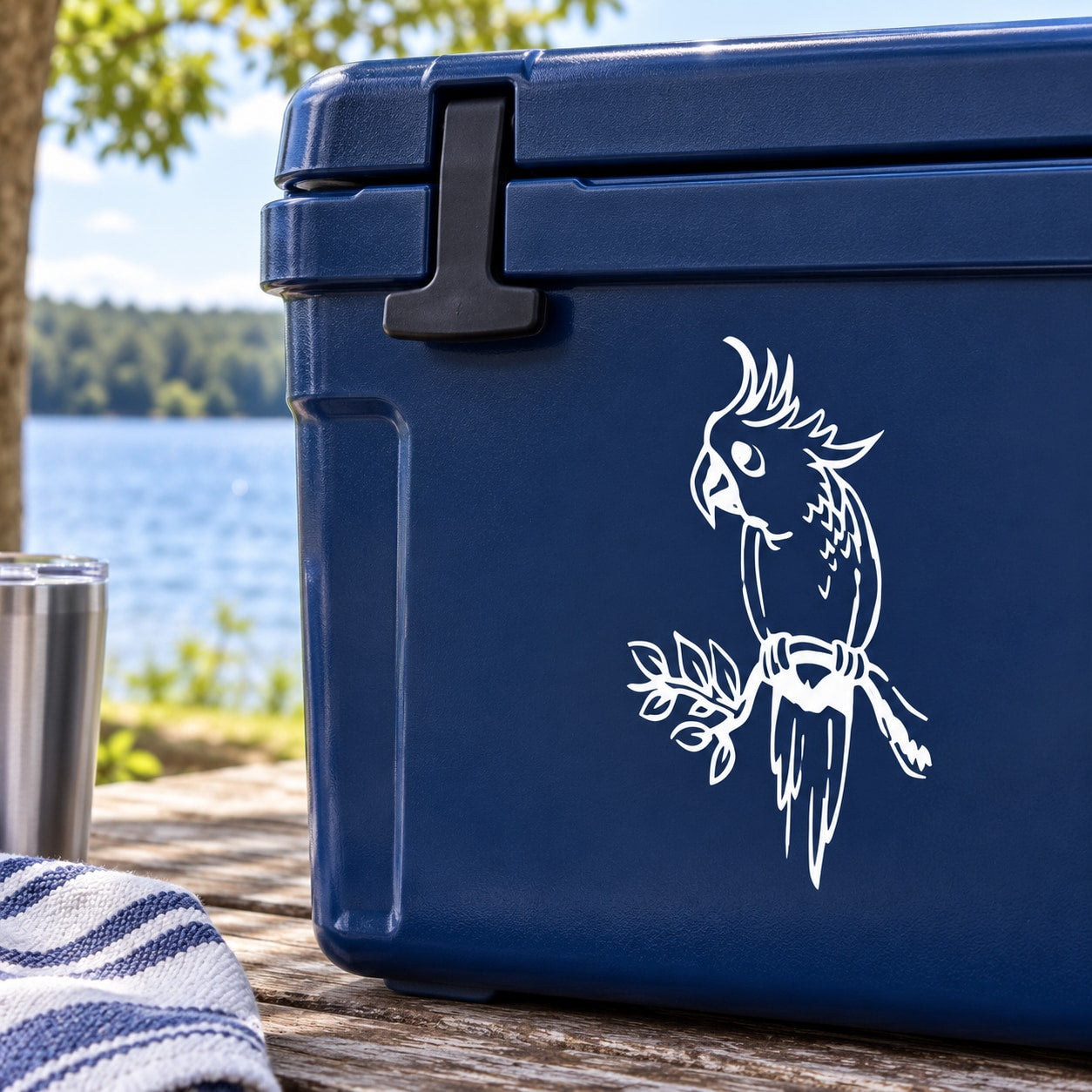 White parrot on leafy branch decal on blue cooler lid