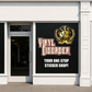 Printed die-cut business logo decal with gold emblem and red/white text on dark backing